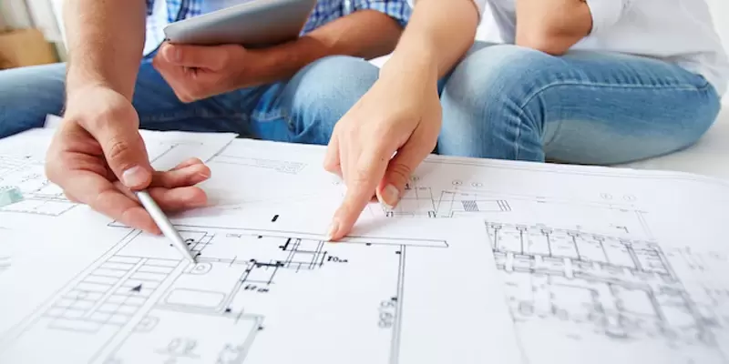 Image of people planing their transportable home with Kiwi Transportable homes in the Waikato