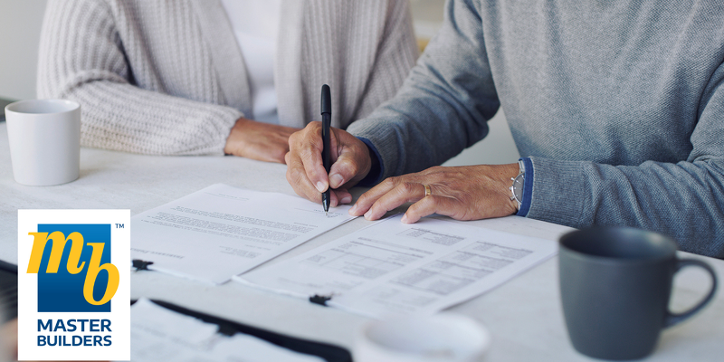 Image of contract being signed for a new transportable home from Kiwi Transportable homes in the Waikato